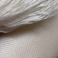 Tulle di seta bobinet/ss bianco latte/blanc 6 buchi/1cm altezza cm 150 € 66,00 al metro, vendita a multipli di 50 cm