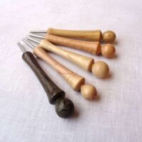 Toglispilli a tubino in legno fossile