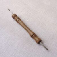 Toglispilli doppio in legno di fossile