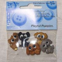 Bottoni decorativi "cuccioli di cane giocosi"