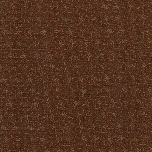 Tessuto Moda Fabrics “Kansas Trouble Favorites” fantasia trifoglio marrone, altezza 110 cm.